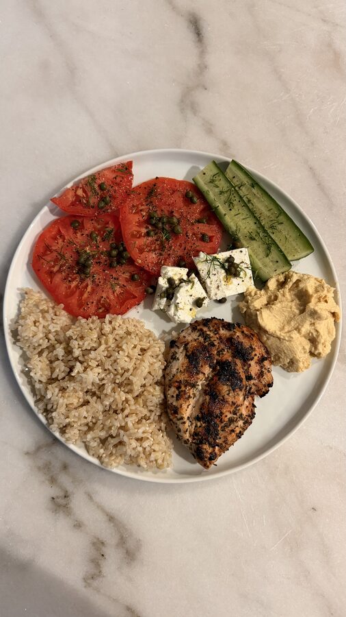 Grilled chicken plate with rice, feta, and hummus