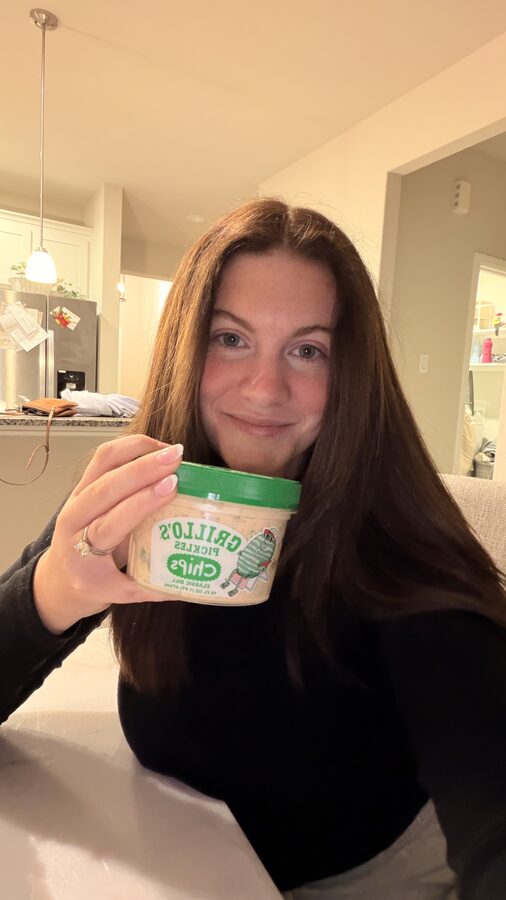 Selfie holding a jar of Grillo's pickle chips